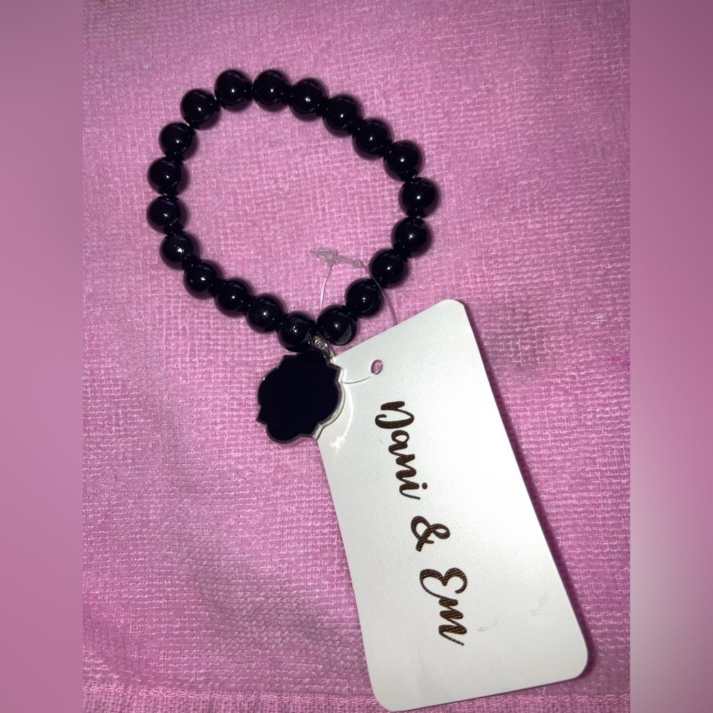 Black beaded bracelet with charm